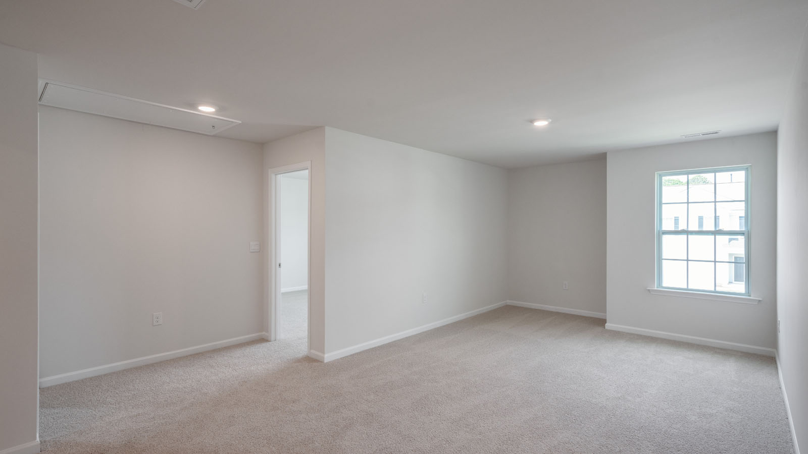 Loft with carpet flooring