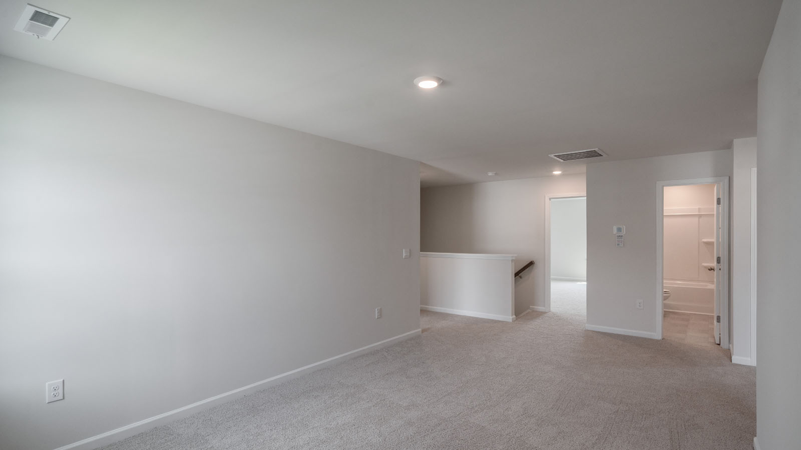 Loft with carpet flooring