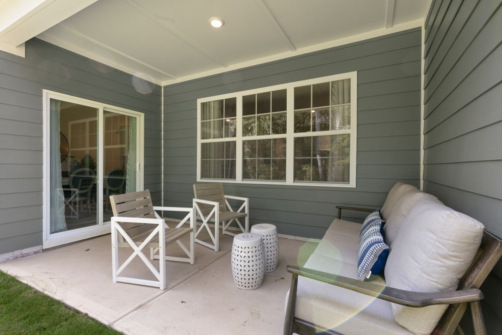 exterior patio with concrete slab and open yard