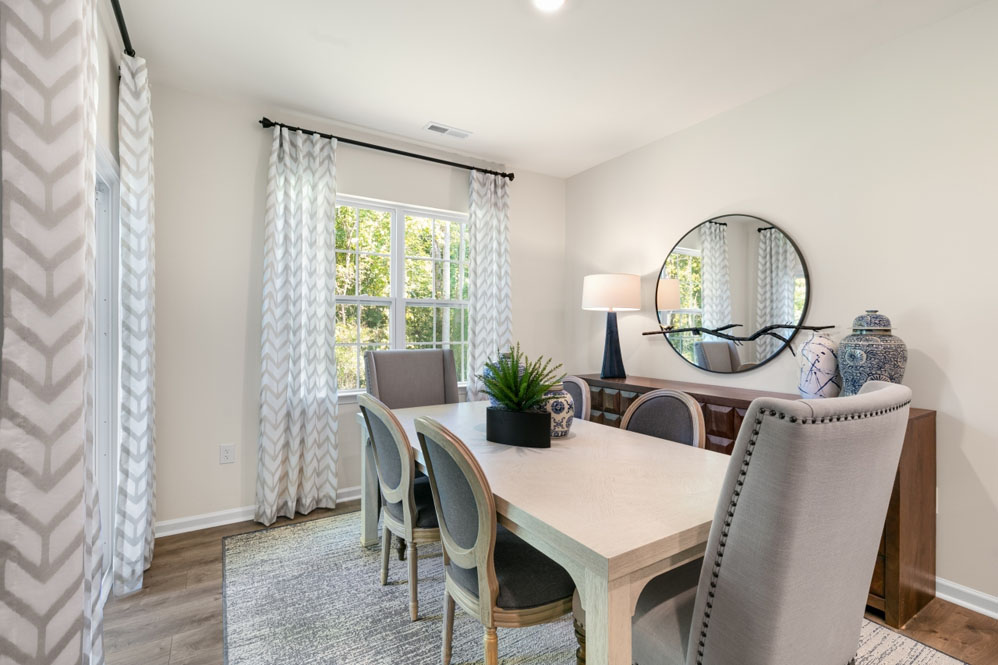 open concept dining space with sliding glass door to patio
