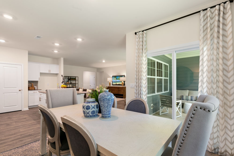 open concept dining space with sliding glass door to patio