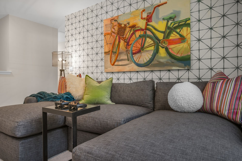 upstairs loft area with large windows and carpeting