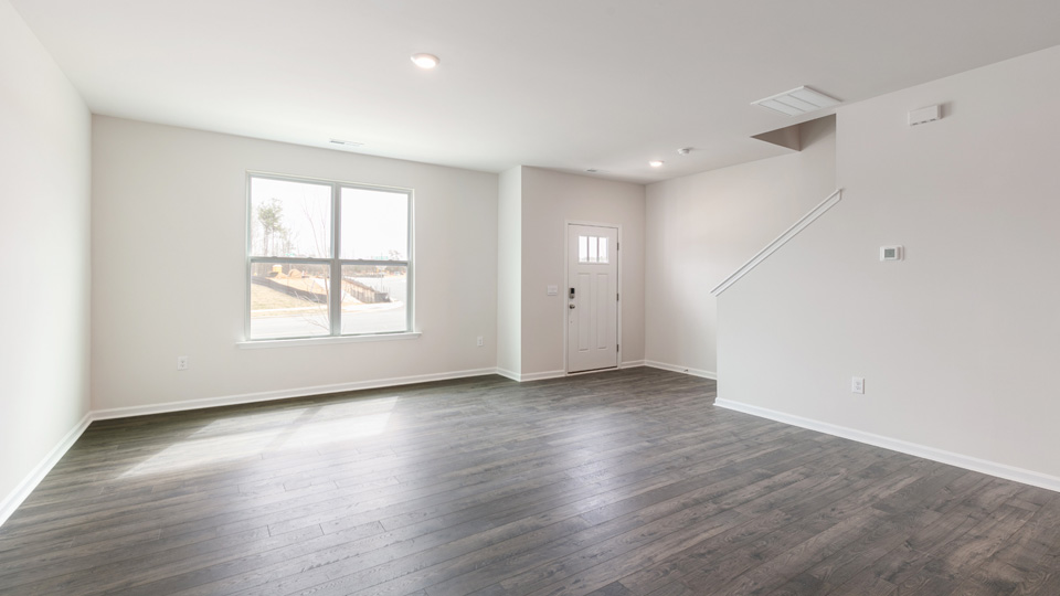 Open-concept living area with revwood flooring