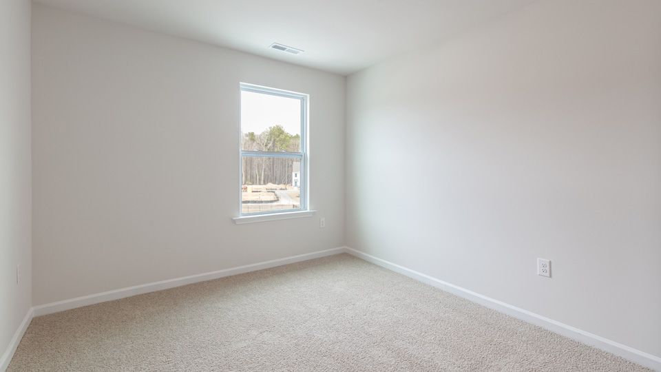 Bedroom with carpet flooring