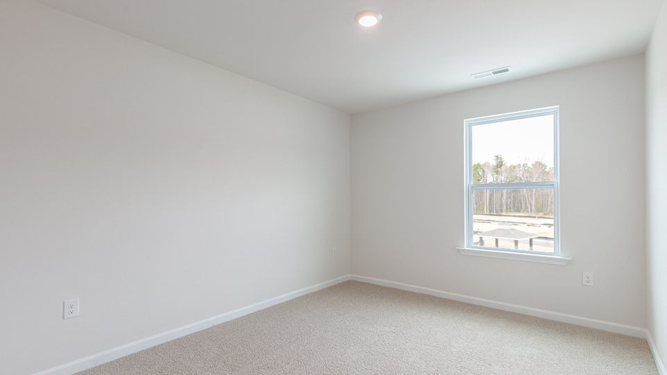 Bedroom with carpet flooring