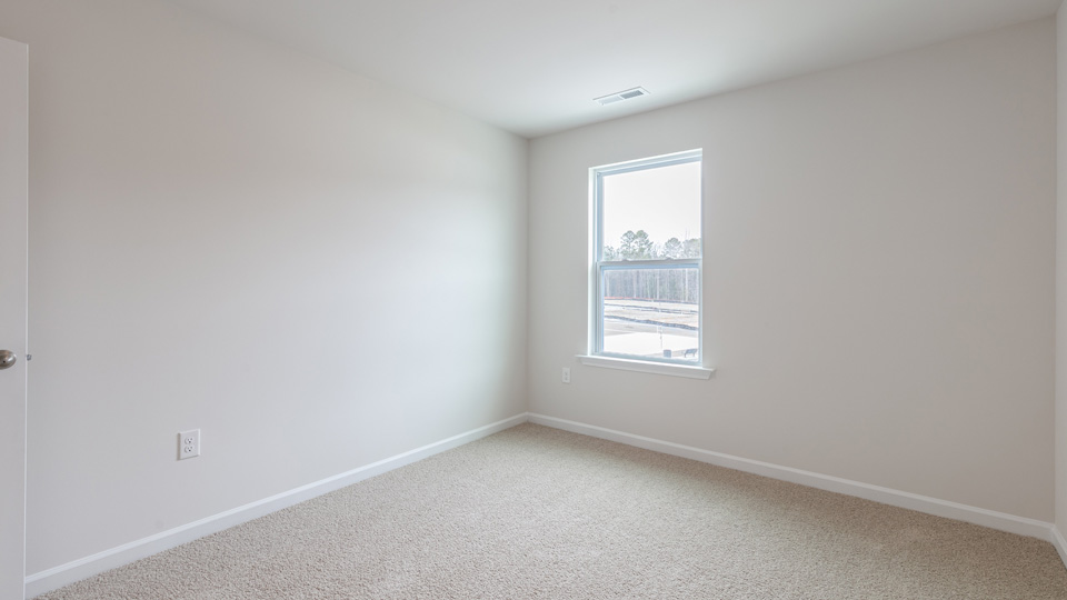 Bedroom with carpet flooring