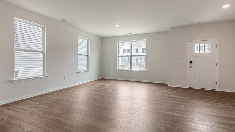 living room area with great open space and natural lighting