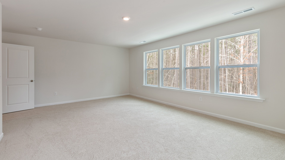 second floor bedroom with carpet flooring