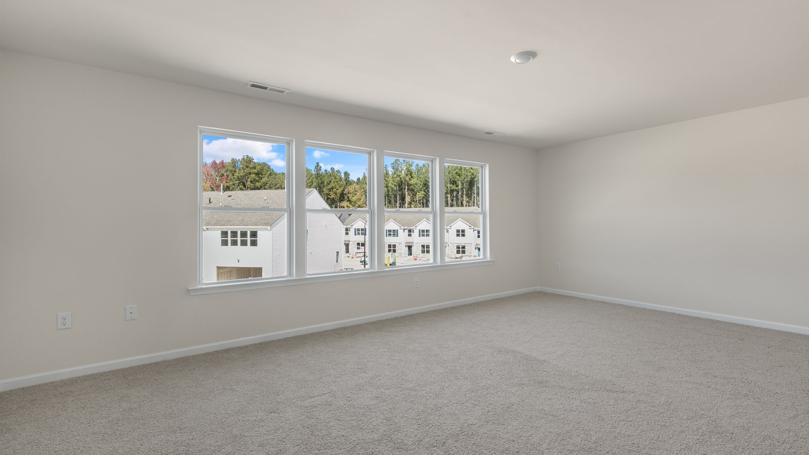 second floor bedroom with carpet flooring