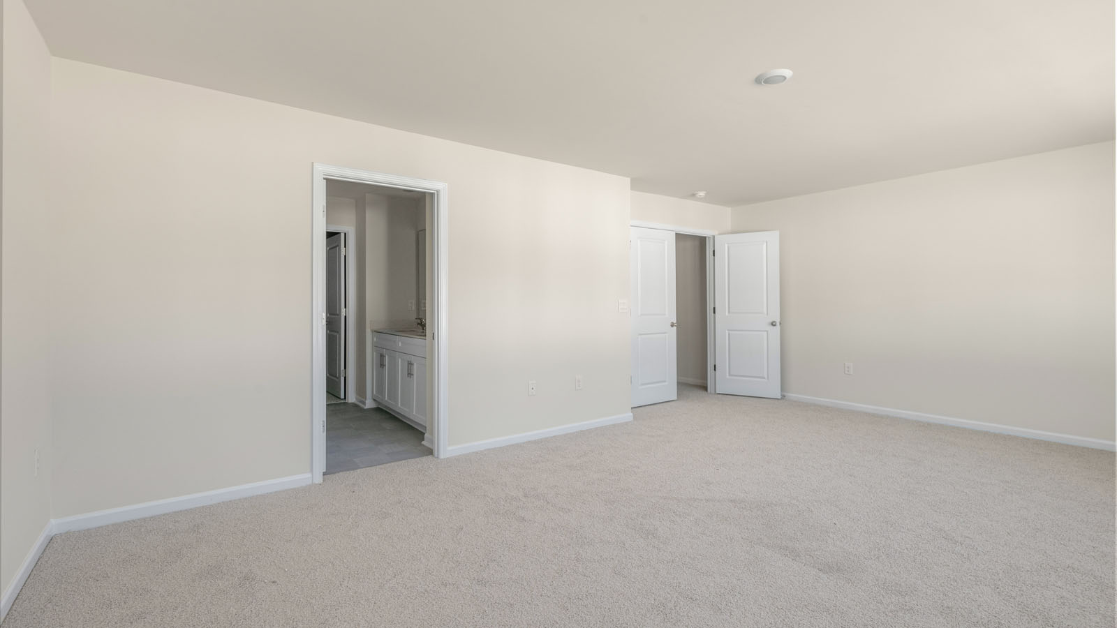 second floor bedroom with carpet flooring