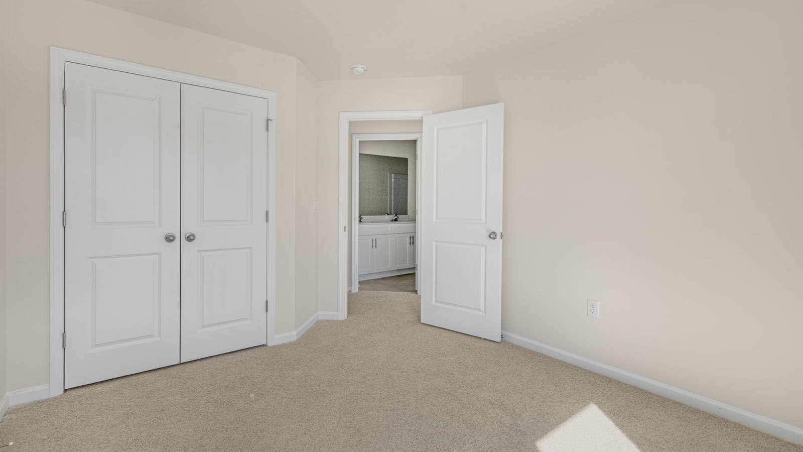 second floor bedroom with carpet flooring