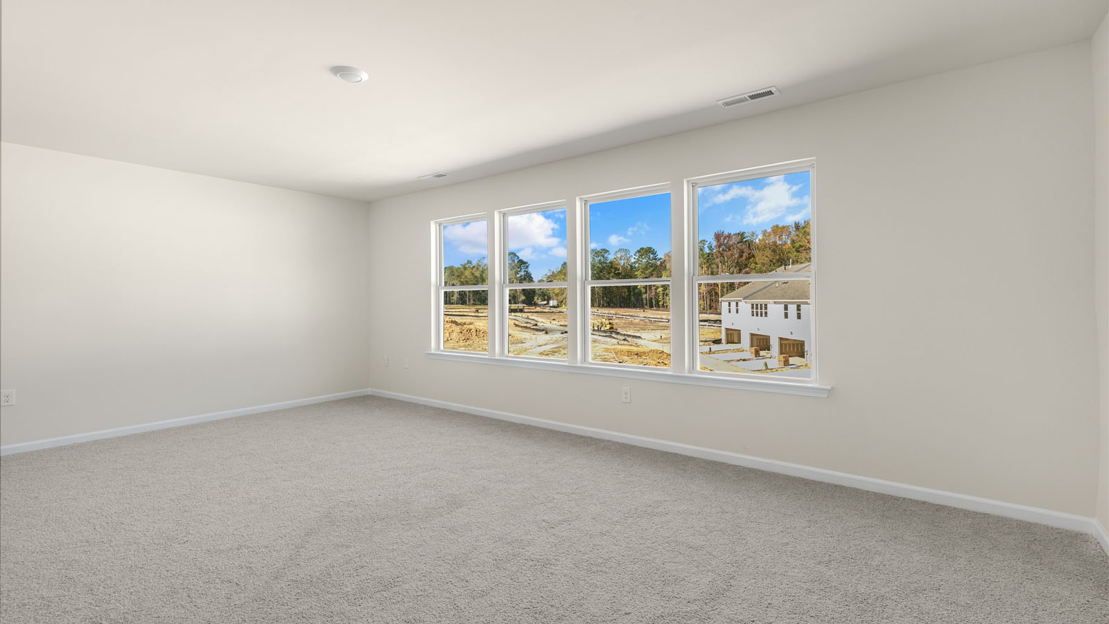 second floor bedroom with carpet flooring