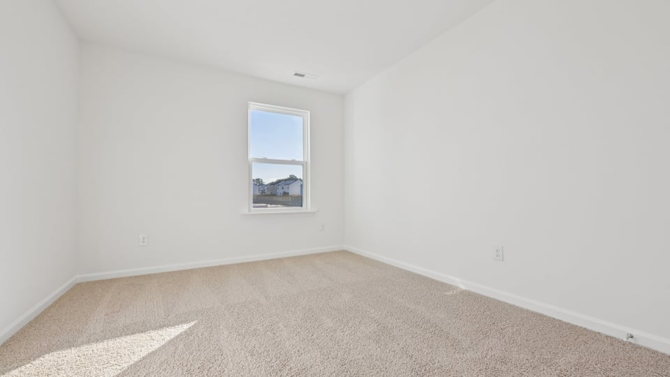 Bedroom with carpet flooring