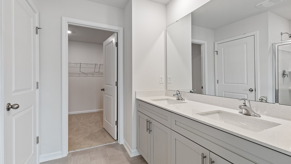 Bathroom with white cabinets