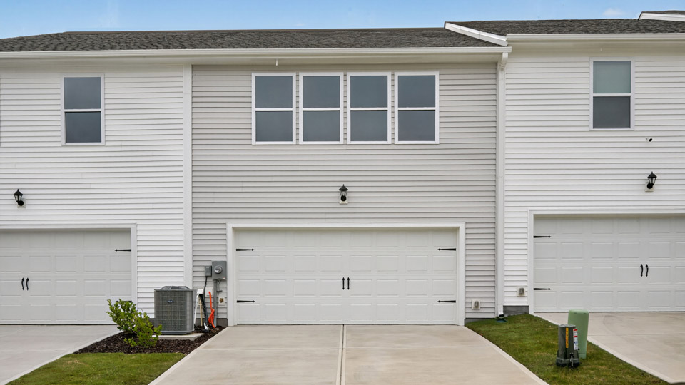 back exterior of rear load blake b with 2 car garage
