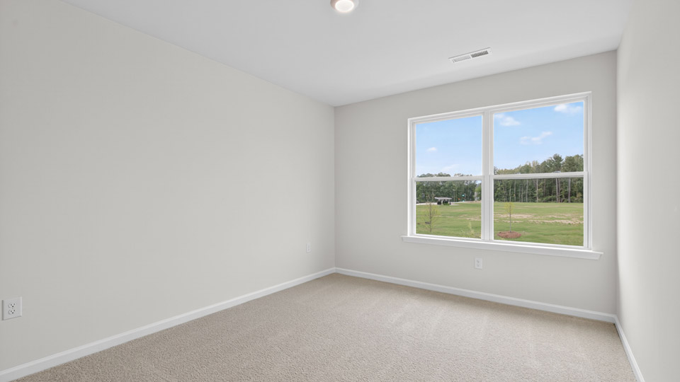 additional bedroom with window, carpeting, closet