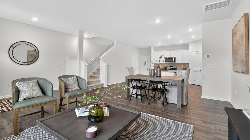 kitchen with quartz counters, kitchen island, pantry, stainless steel appliances