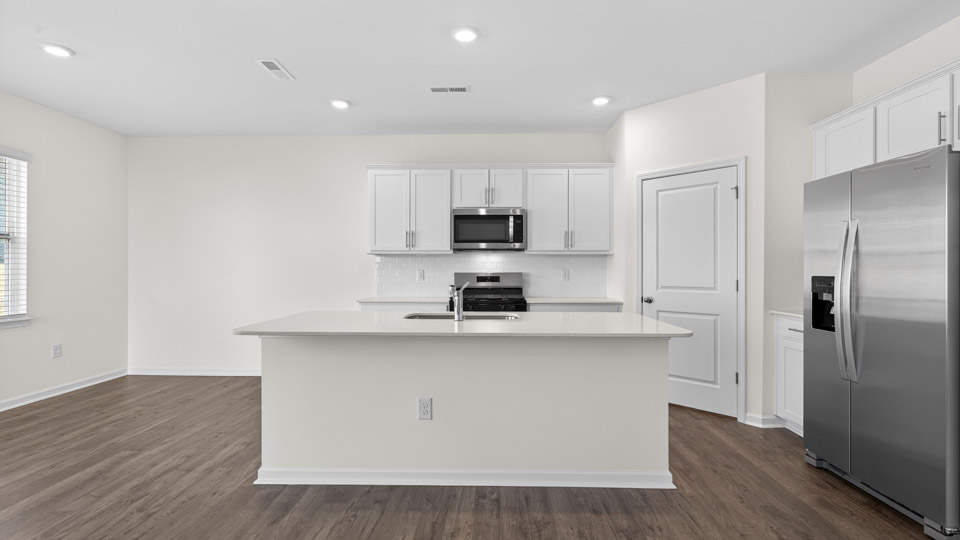 Kitchen with white cabinets and stainless steel appliances.