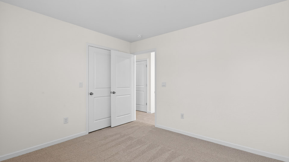 Bedroom with carpet floor and closet