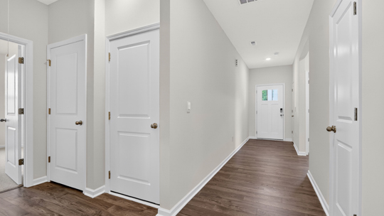 foyer entryway with revwood flooring