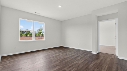 living room with revwood flooring and lots of natural light