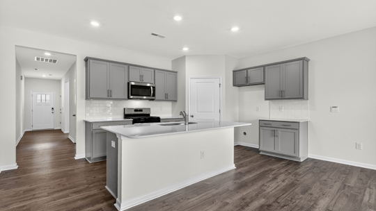 kitchen island overlooking dining and living areas