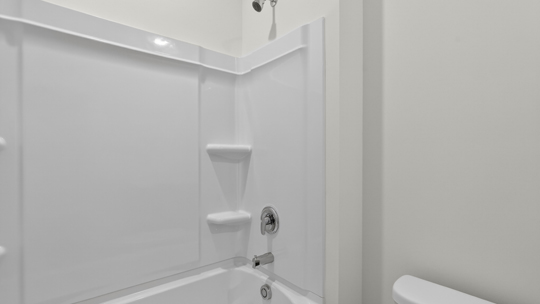 bathroom with tub shower combo