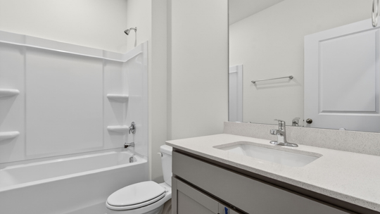 bathroom with tub shower combo