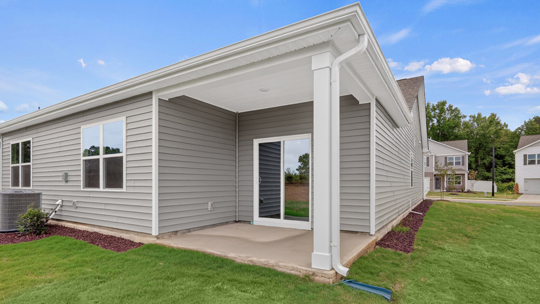 back of cali with covered concrete patiop