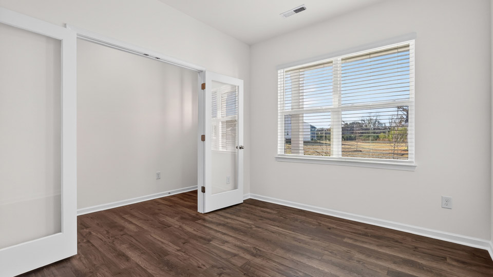 Study room with hardwood floors and big windows