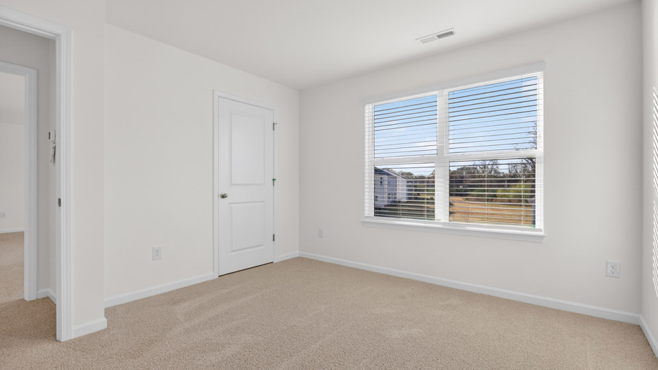 Bedroom with carpet floor and closet