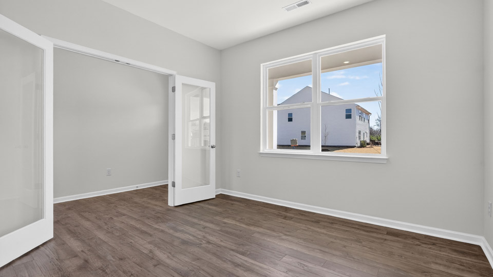 Study room with hardwood floors and big windows