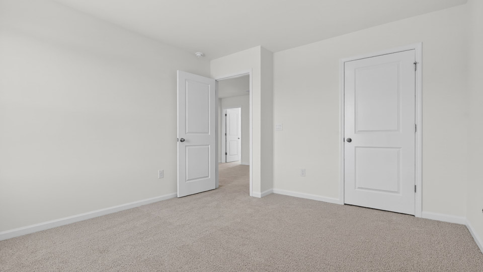 Bedroom with carpet floor and closet