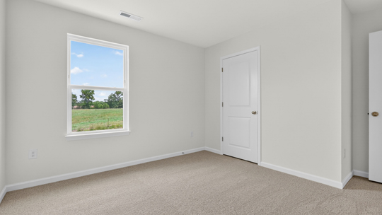 additional bedroom with window, carpeting, closet