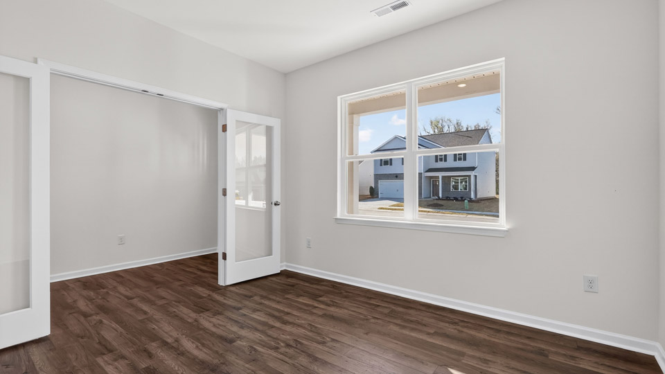Study room with hardwood floors and big windows