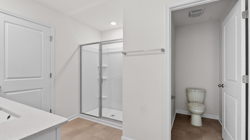 Primary bathroom with double sink and walk-in shower