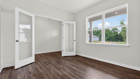 study with revwood flooring and double glass french doors