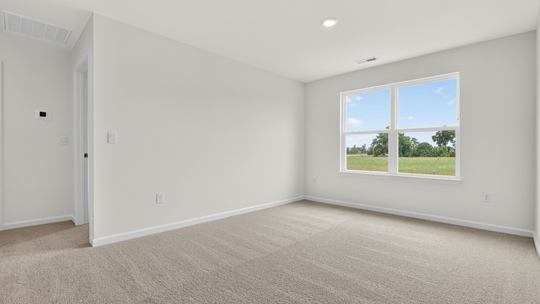 loft with carpet flooring