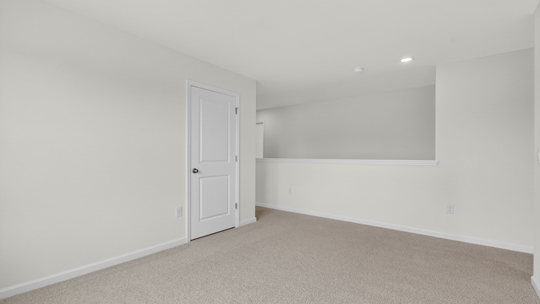 loft with carpet flooring