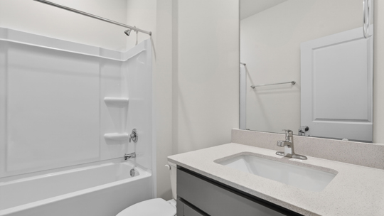 bathroom with tub shower combo