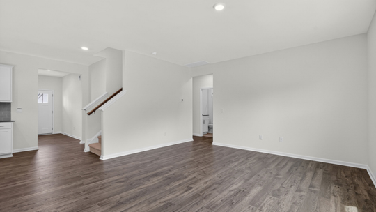 open concept living room with revwood flooring