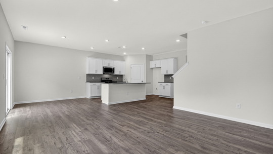 open concept kitchen dining and living areas