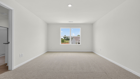 loft with carpet flooring