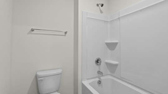bathroom with tub shower combo