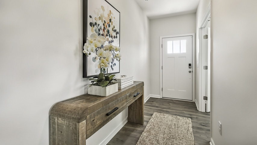 foyer entryway with revwood flooring