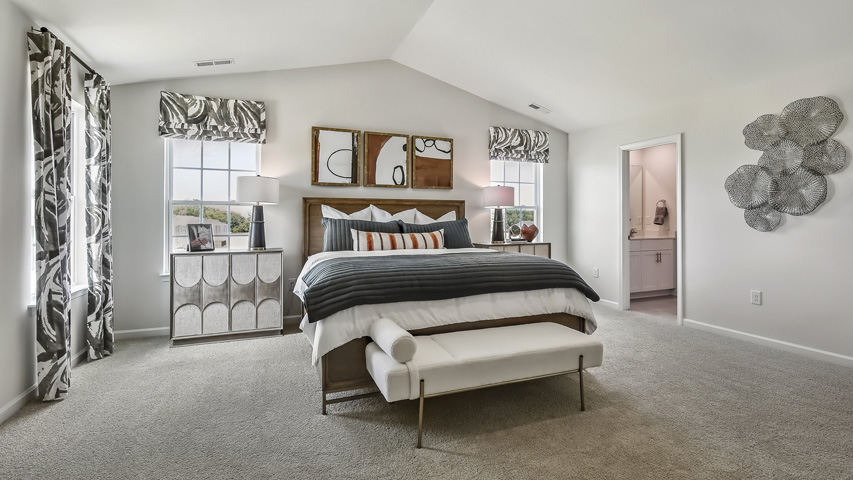 bedroom with vaulted ceiling and carpet flooring
