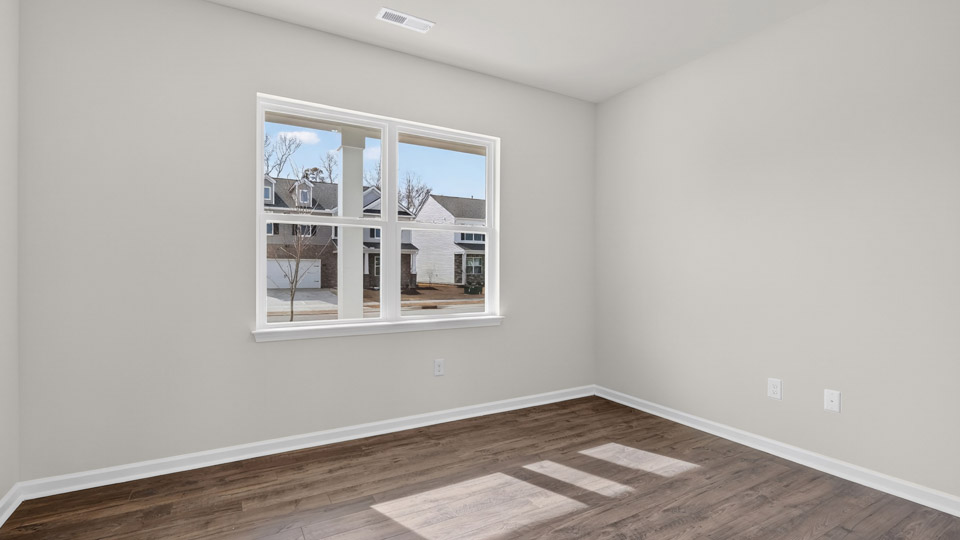 Study room with hardwood floors and big windows