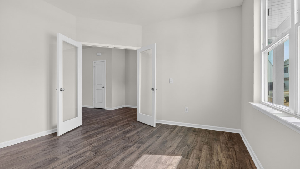 Study room with hardwood floors and big windows