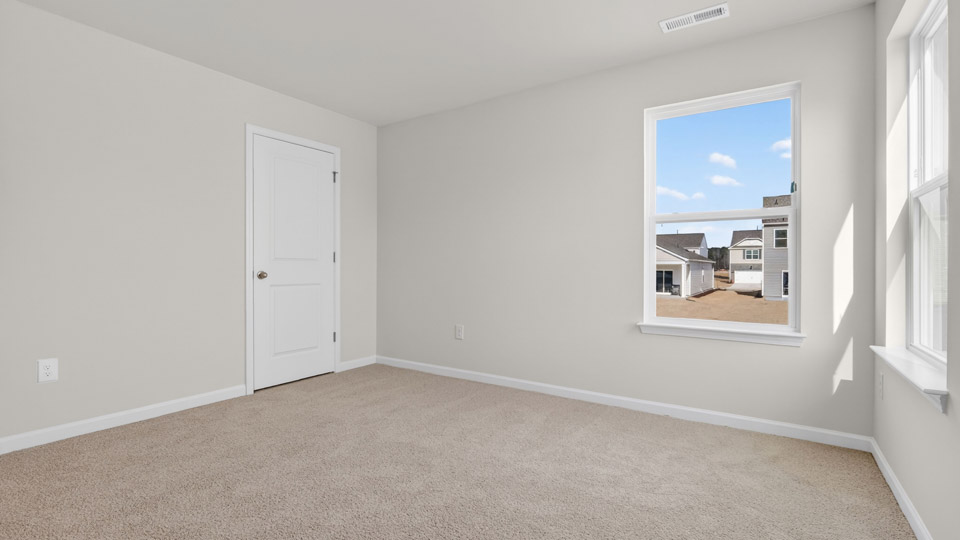 Bedroom with carpet floor and closet