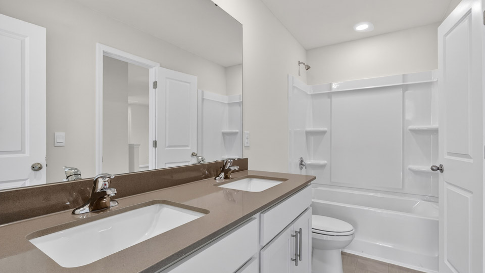 Bathroom with double sinks & tub